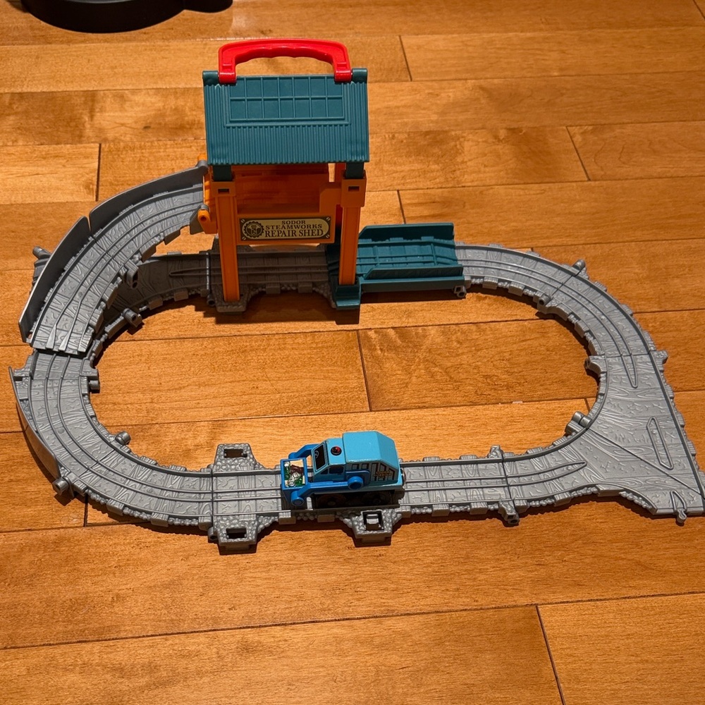 Thomas & Friends blue engine with orange station and gray track